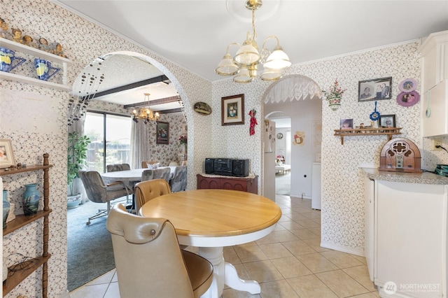 515 N Clark Rd, Moses Lake, WA 98837 - dining area with a chandelier, arched walkways, wallpapered walls, light tile patterned floors, and crown molding