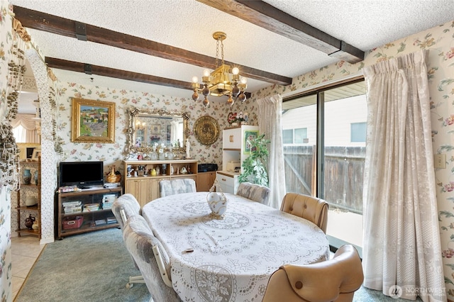 515 N Clark Rd, Moses Lake, WA 98837 - dining space featuring wallpapered walls, a chandelier, beamed ceiling, a textured ceiling, and light tile patterned floors