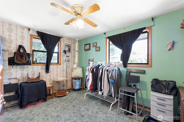 515 N Clark Rd, Moses Lake, WA 98837 - miscellaneous room with wallpapered walls, plenty of natural light, carpet, ceiling fan, and a baseboard radiator