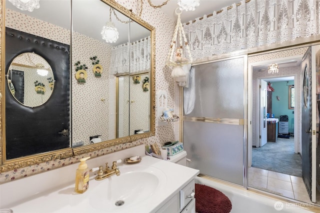 515 N Clark Rd, Moses Lake, WA 98837 - bathroom with wallpapered walls, vanity, shower / bath combination with glass door, and tile patterned floors