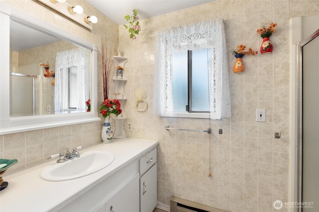515 N Clark Rd, Moses Lake, WA 98837 - full bath featuring a stall shower, vanity, tasteful backsplash, and tile walls