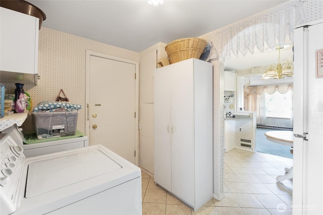 515 N Clark Rd, Moses Lake, WA 98837 - washroom with light tile patterned floors, washing machine and clothes dryer, and wallpapered walls