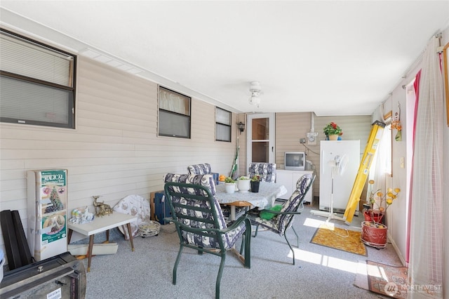 515 N Clark Rd, Moses Lake, WA 98837 - carpeted dining area with wood walls