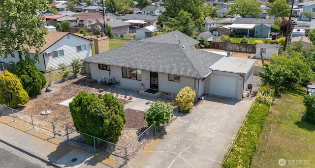 515 N Clark Rd, Moses Lake, WA 98837 - view of front of house with a residential view, an attached garage, driveway, and a shingled roof