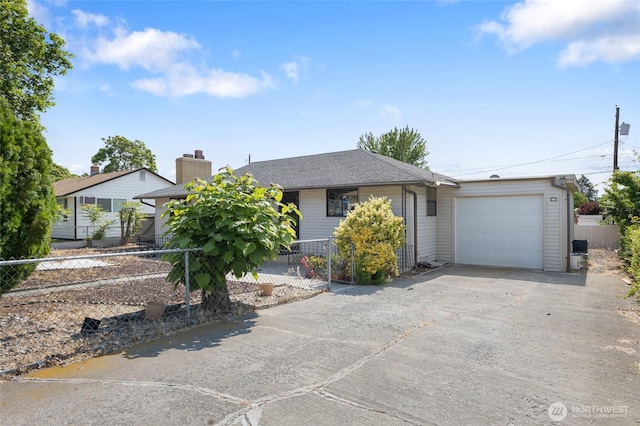 515 N Clark Rd, Moses Lake, WA 98837 - ranch-style home with a garage, asphalt driveway, and a chimney
