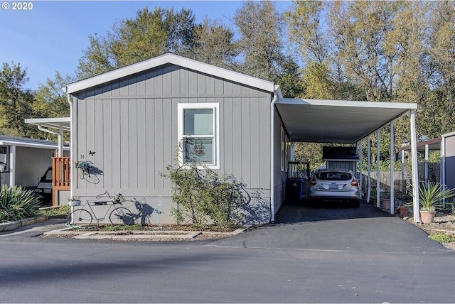 1693 N Sheperd Rd Unit 14, Washougal, WA 98671 - view of home's exterior featuring driveway and a carport