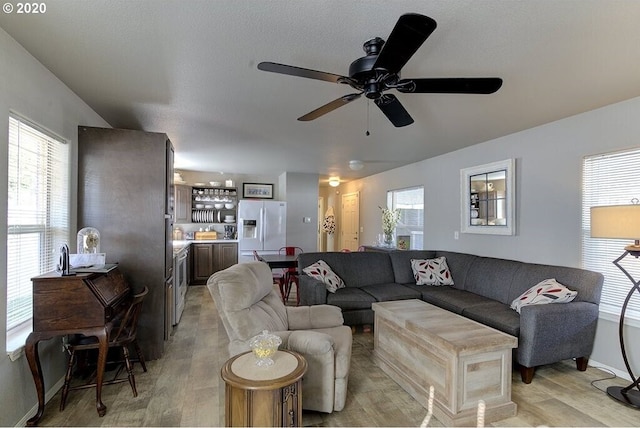 1693 N Sheperd Rd Unit 14, Washougal, WA 98671 - living area featuring a ceiling fan, light wood-type flooring, and baseboards