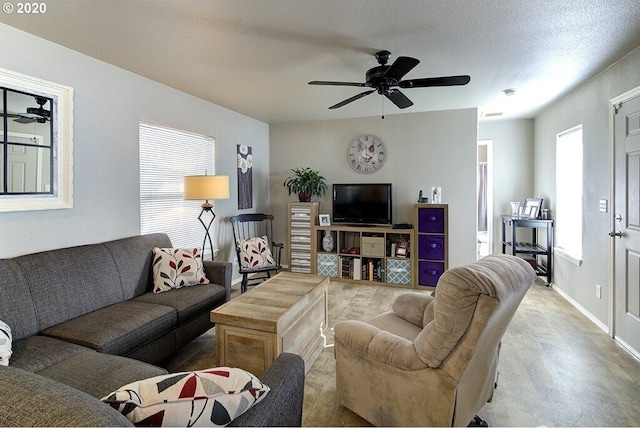 1693 N Sheperd Rd Unit 14, Washougal, WA 98671 - living area featuring wood finished floors, a ceiling fan, and baseboards
