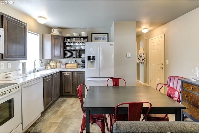 1693 N Sheperd Rd Unit 14, Washougal, WA 98671 - kitchen featuring white appliances, a sink, dark brown cabinetry, and light countertops