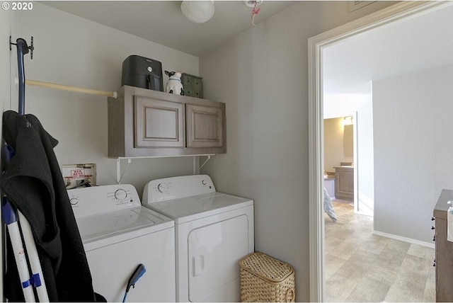 1693 N Sheperd Rd Unit 14, Washougal, WA 98671 - washroom with cabinet space, separate washer and dryer, and baseboards
