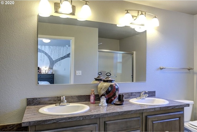 1693 N Sheperd Rd Unit 14, Washougal, WA 98671 - full bath with double vanity, an enclosed shower, toilet, and a textured wall