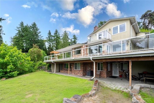 31111 53rd Ave SW, Federal Way, WA 98023 - back of house with a yard, a patio area, a chimney, brick siding, and central AC unit