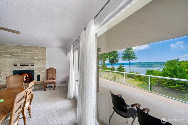 31111 53rd Ave SW, Federal Way, WA 98023 - balcony featuring a fireplace and a water view