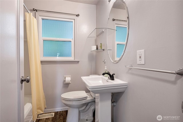 31111 53rd Ave SW, Federal Way, WA 98023 - full bathroom featuring toilet, shower / bath combo with shower curtain, baseboards, and wood finished floors