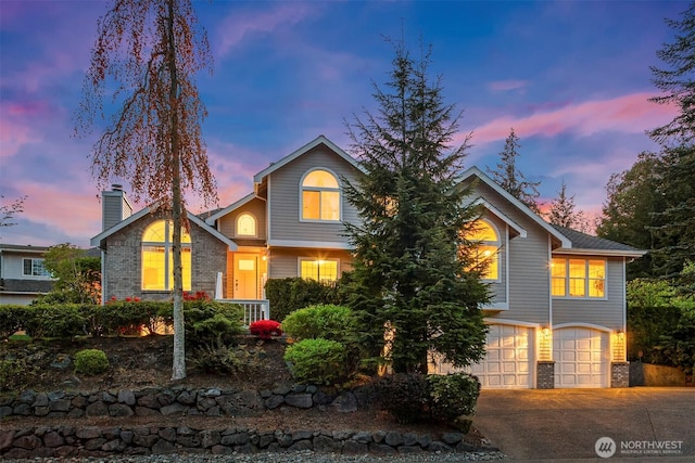 6513 156th Ave SE, Bellevue, WA 98006 - traditional-style house featuring an attached garage, brick siding, driveway, and a chimney
