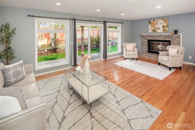 6513 156th Ave SE, Bellevue, WA 98006 - living room with wood finished floors, recessed lighting, a fireplace, and baseboards