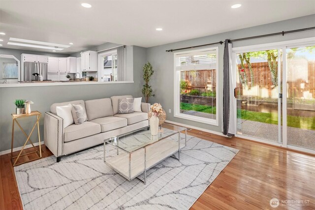 6513 156th Ave SE, Bellevue, WA 98006 - living room featuring light wood-type flooring, recessed lighting, and baseboards