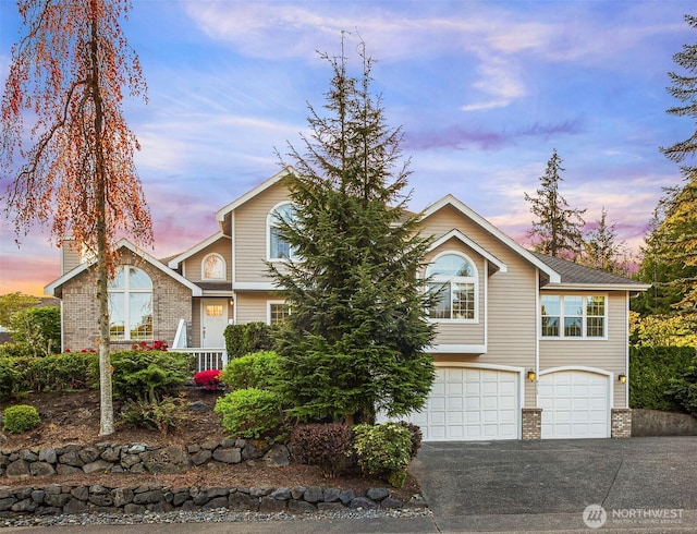 6513 156th Ave SE, Bellevue, WA 98006 - view of front of home featuring brick siding, a garage, and driveway