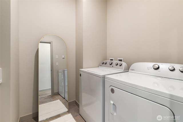 4260 Creston Way, Bellingham, WA 98226 - washroom featuring independent washer and dryer, arched walkways, and baseboards