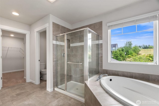 2719 Fiddleback St NE, Lacey, WA 98516 - full bath featuring a shower stall, a bath, toilet, a walk in closet, and recessed lighting