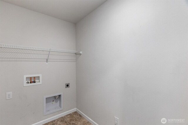 2719 Fiddleback St NE, Lacey, WA 98516 - laundry area featuring electric dryer hookup, baseboards, hookup for a washing machine, and light tile patterned flooring