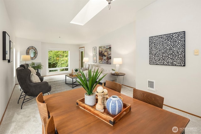12315 NE 97th St Unit G, Kirkland, WA 98033 - carpeted dining room with a skylight and baseboards