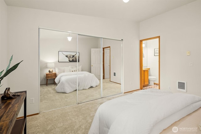 12315 NE 97th St Unit G, Kirkland, WA 98033 - bedroom with carpet floors, a closet, connected bathroom, and heating unit