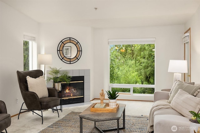12315 NE 97th St Unit G, Kirkland, WA 98033 - living room featuring light colored carpet and a tiled fireplace