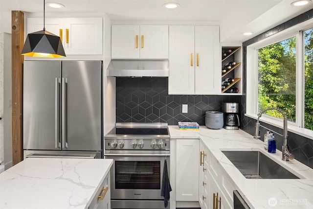 13117 NE 128th Pl NE, Kirkland, WA 98034 - kitchen with stainless steel appliances, range hood, decorative backsplash, a sink, and white cabinetry