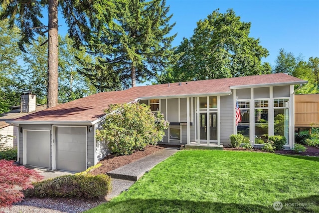 13117 NE 128th Pl NE, Kirkland, WA 98034 - view of front of property with french doors, a front lawn, a chimney, and a garage