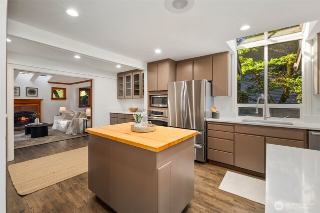 16939 SE 39th St, Bellevue, WA 98008 - kitchen with stainless steel appliances, a sink, butcher block countertops, a kitchen island, and open floor plan