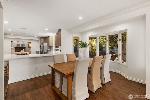 16939 SE 39th St, Bellevue, WA 98008 - dining space featuring ornamental molding, dark wood-style floors, recessed lighting, and baseboards