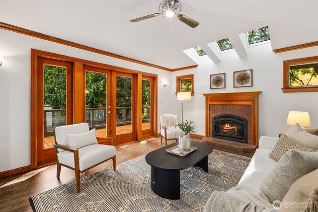 16939 SE 39th St, Bellevue, WA 98008 - living room featuring plenty of natural light, a skylight, french doors, ceiling fan, and lofted ceiling