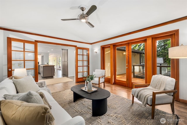 16939 SE 39th St, Bellevue, WA 98008 - living area featuring french doors, lofted ceiling, wood finished floors, ornamental molding, and ceiling fan