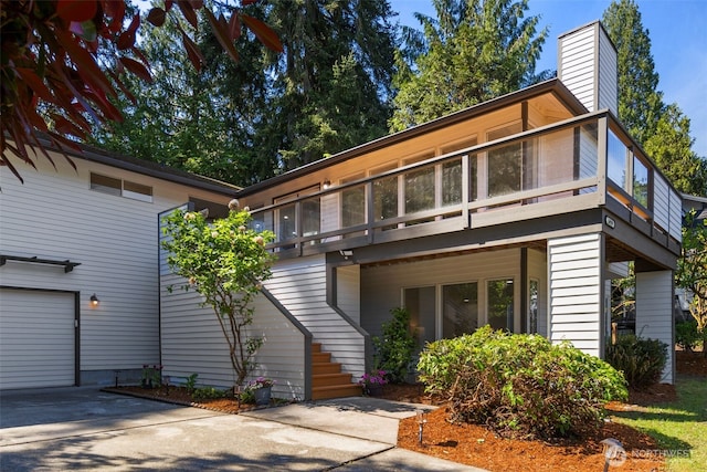 16939 SE 39th St, Bellevue, WA 98008 - view of front of property featuring driveway, stairway, and a chimney
