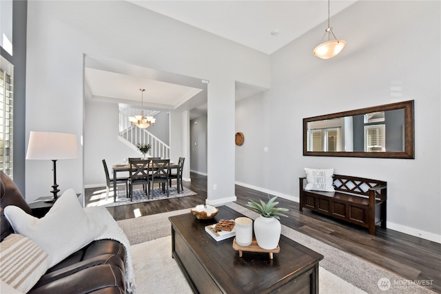 23804 17th Pl W, Bothell, WA 98021 - living room featuring dark wood-style flooring, a chandelier, and baseboards
