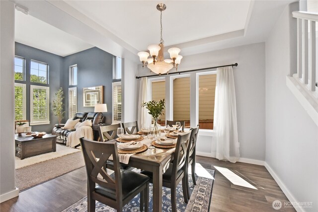 23804 17th Pl W, Bothell, WA 98021 - dining space with a chandelier, wood finished floors, and baseboards