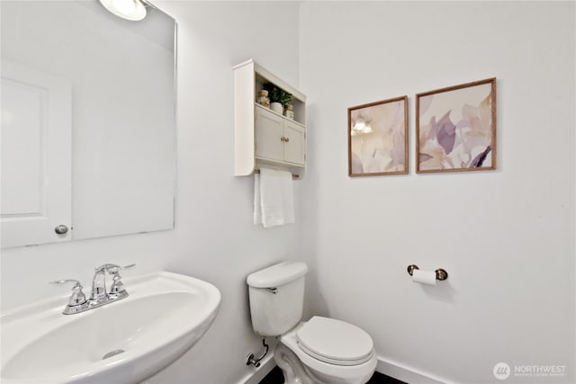 23804 17th Pl W, Bothell, WA 98021 - bathroom featuring a sink, toilet, and baseboards
