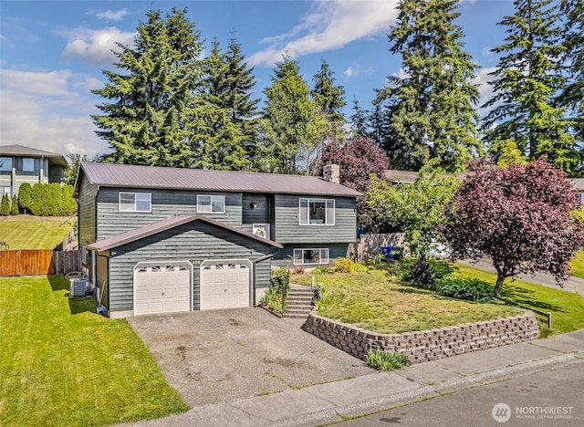 404 Veralene Way SW, Everett, WA 98203 - raised ranch featuring asphalt driveway, an attached garage, cooling unit, and metal roof