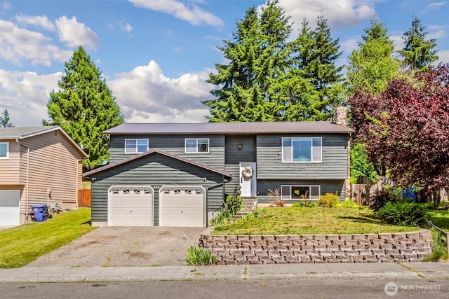 404 Veralene Way SW, Everett, WA 98203 - raised ranch with driveway, metal roof, a front lawn, and a chimney