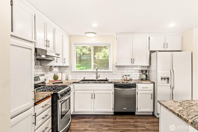404 Veralene Way SW, Everett, WA 98203 - kitchen with appliances with stainless steel finishes, under cabinet range hood, a sink, white cabinets, and light stone countertops