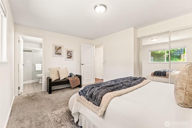 404 Veralene Way SW, Everett, WA 98203 - carpeted bedroom featuring a closet, ensuite bathroom, and baseboards