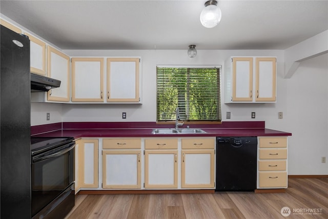 7549 Siskin Dr SE, Olympia, WA 98513 - kitchen featuring black appliances, a sink, range hood, dark countertops, and light wood-style floors