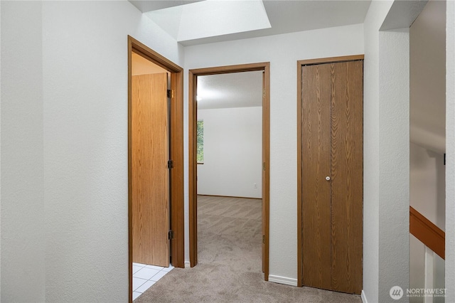 7549 Siskin Dr SE, Olympia, WA 98513 - hallway featuring light colored carpet and a textured wall