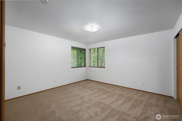 7549 Siskin Dr SE, Olympia, WA 98513 - spare room with carpet, baseboards, and a textured ceiling