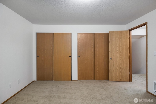 7549 Siskin Dr SE, Olympia, WA 98513 - unfurnished bedroom featuring multiple closets and carpet floors