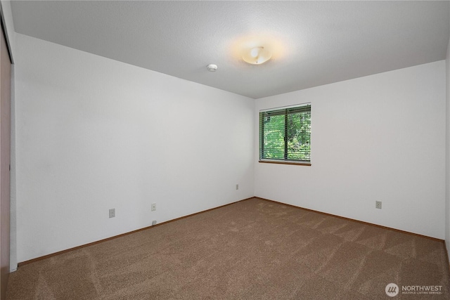 7549 Siskin Dr SE, Olympia, WA 98513 - empty room featuring carpet flooring, baseboards, and a smoke detector