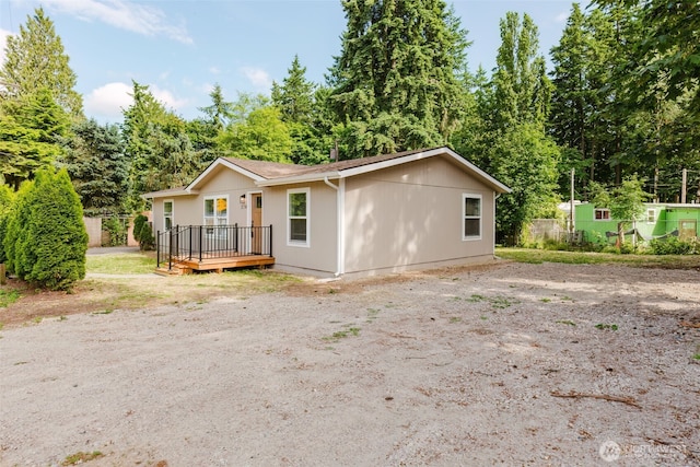270 Granat St, Port Orchard, WA 98366 - view of front of home with a deck and view of wooded area