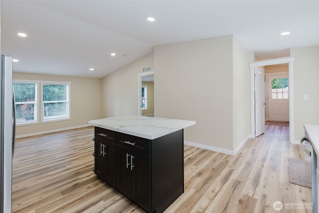 270 Granat St, Port Orchard, WA 98366 - kitchen featuring dark cabinetry, light wood-type flooring, light stone countertops, recessed lighting, and baseboards