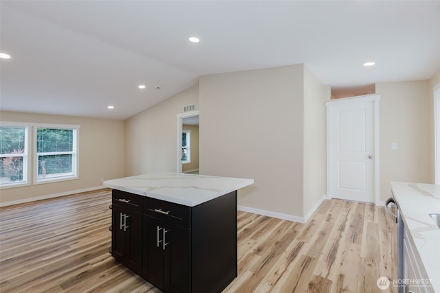 270 Granat St, Port Orchard, WA 98366 - kitchen featuring dark cabinetry, light wood-type flooring, recessed lighting, light stone countertops, and baseboards